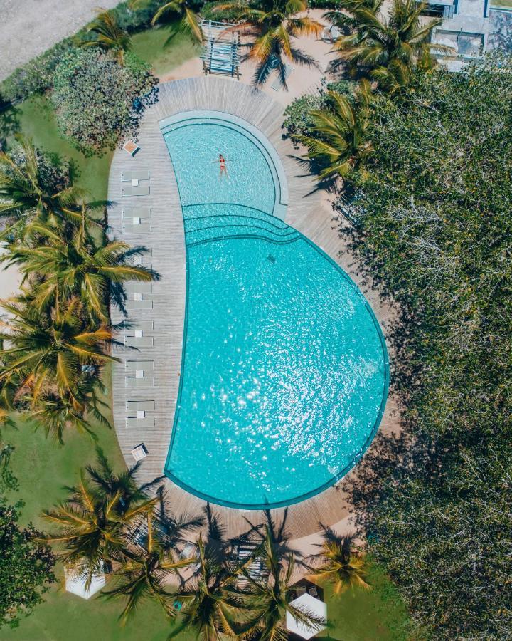 Lux* Grand Gaube Resort & Villas Esterno foto Aerial view of the pool at the 2019 World Championships